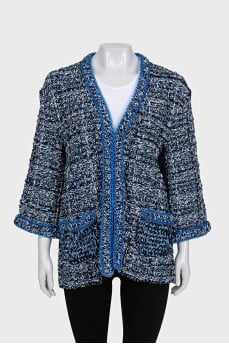 Blue cardigan decorated with piping