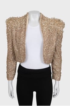 A cropped jacket decorated with crystals and sequins