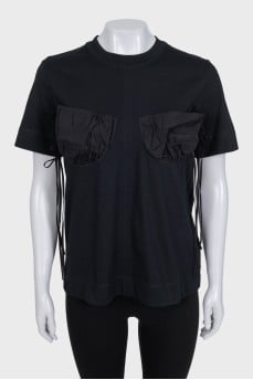 Black t-shirt with accent pockets and tag