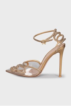 Golden slingbacks decorated with rhinestones