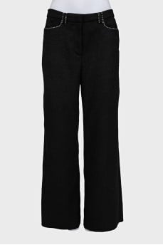 Black trousers with decorated pockets
