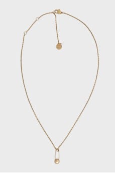 Gold necklace with a pin
