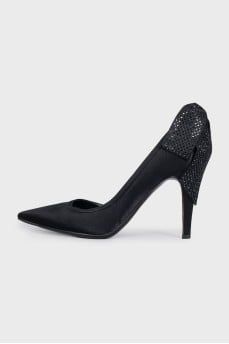 Black pumps decorated with rhinestones
