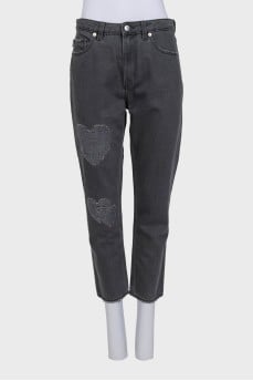 Tapered grey jeans with distressing