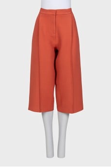 Orange cropped trousers