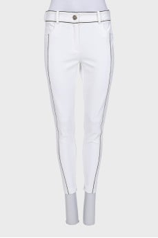 White tapered trousers with black trim