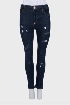 Skinny jeans with a distressed effect