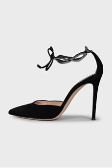 Black suede shoes decorated with rhinestones