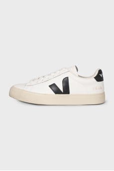 Black and white leather sneakers with a signature logo