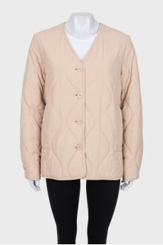 Quilted beige jacket with a straight cut