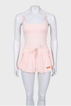 A suit consisting of a tank top and shorts with a tag