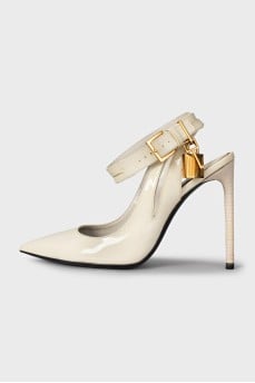 Patent leather slingbacks with a gold pendant