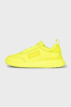 Yellow leather sneakers with the brand logo