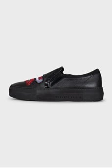 Leather slip-ons decorated with embroidery