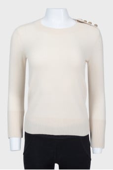 Beige sweater with cuffs on buttons