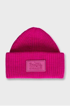 Pink knitted hat with logo