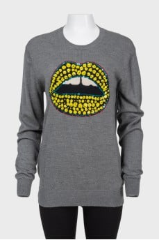 Sweater with sequins in the form of lips