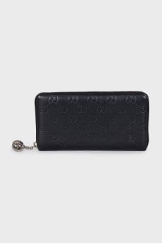 Black leather wallet with branded embossing