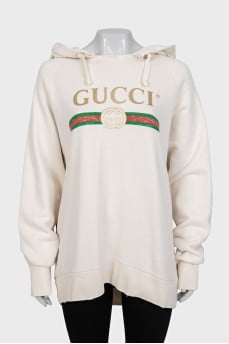 Hoodie with a ripped effect and embroidered details