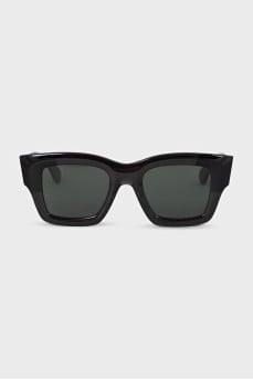 Black sunglasses with green lenses