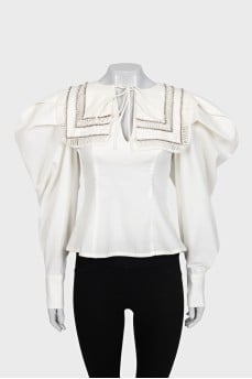 Fitted blouse decorated with crystals