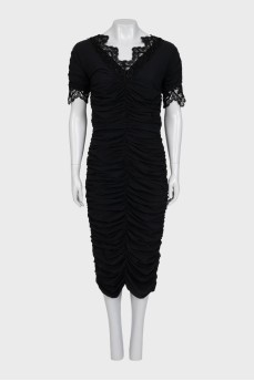 Black dress with draping and lace trim