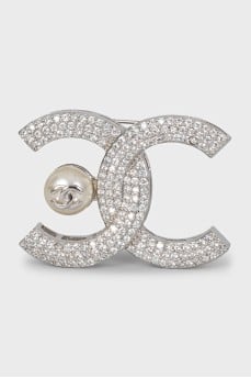 Silver logo brooch with rhinestones