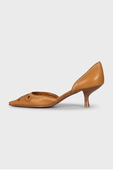 Leather shoes decorated with perforations
