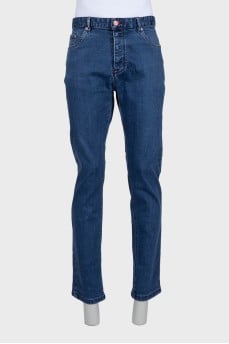 Men's blue jeans with a red stripe