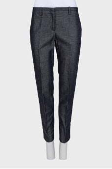 Blue trousers with silk inserts and tag