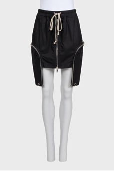Mini skirt with decorative pockets and ties