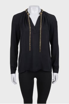 Black loose-fitting blouse with decoration