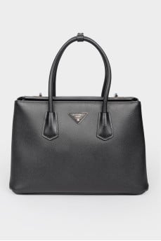 Black leather bag on pens on a rotary fastener