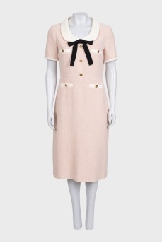 Fitted dress decorated with gold buttons