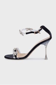 Black sandals decorated with bows