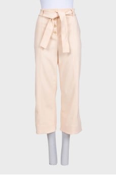 Beige cropped trousers with tag