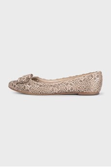 Beige ballet flats decorated with perforations