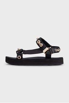 Black sandals with gold hardware