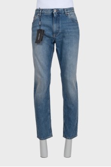Men's blue distressed jeans with a zipper