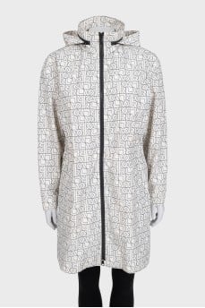 A fitted coat in a signature print with a tag