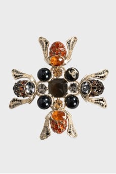 A voluminous brooch decorated with crystals
