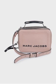 Beige leather bag with black logo