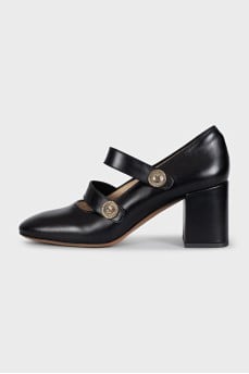 Black leather shoes with gold decor