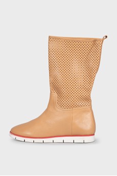 Beige leather boots with perforations