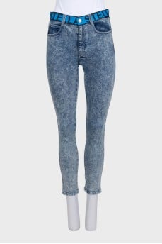 Blue jeans with a signature print