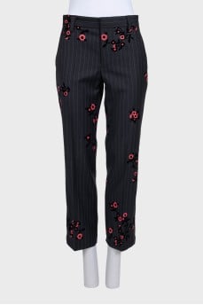 Straight-leg wool trousers decorated with appliqués