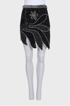 Mini skirt decorated with beads