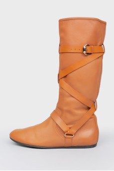 Brown leather boots with metal buckle