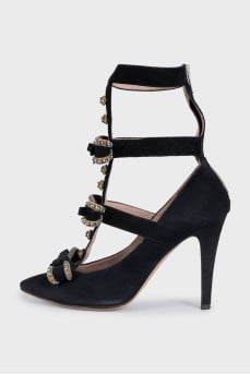 Suede shoes decorated with crystals and a zipper