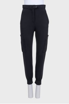 Black tapered trousers with printed patch pockets